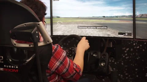 Girl playing auto simulator with virtual reality VR glasses Stock Footage 68800873
