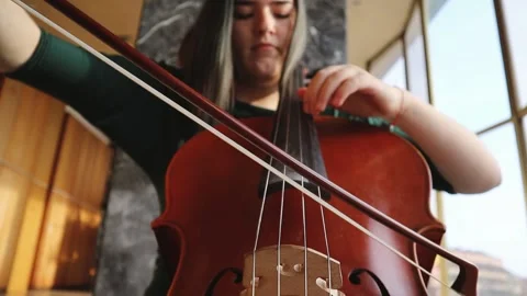Girl Playing a Cello Stock Footage 144972003