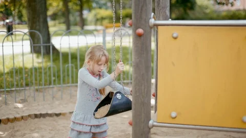 Girl is Playing with Educational Developing Equipment and Sand on the Playground Video stock 104720990