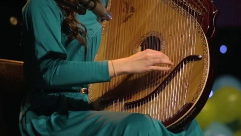 Girl playing ethnic instruments Stock Footage 71506882