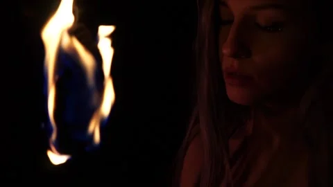 Girl playing with fire Stock Footage 141796150