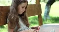 Girl playing the game on his smartphone HD Footage