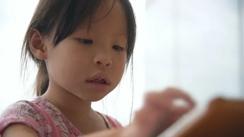 Girl playing games on tablet computer Stock Footage 95505370