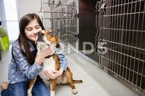 Girl Playing With Her Pet Dog