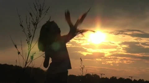 Girl playing with a kite Stock Footage 10879145