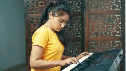Girl playing piano Stock Footage