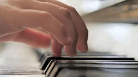 Girl is playing the piano. hands close-up. piano key Stock Footage 126001053