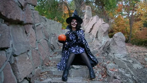 Girl playing with pumpkin Video stock 141055020