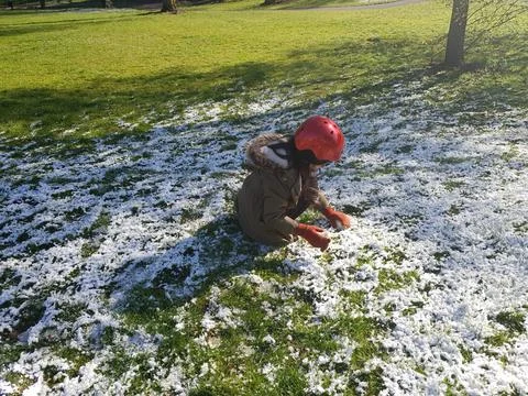 Girl Playing with Snow Stock Photos
