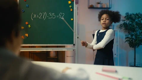 Girl playing strict math teacher, scolding pupil during lesson, classroom game Stock Footage 308000700