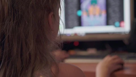 A girl plays a computer game on a computer closeup Stock Footage 106957397