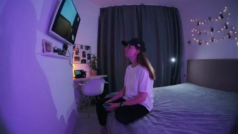A girl plays a computer game. Stock Footage 252435944