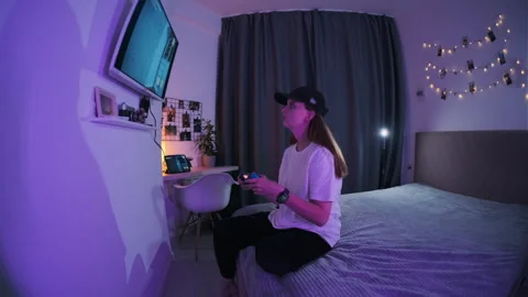 A girl plays a computer game Stock Footage 252436003