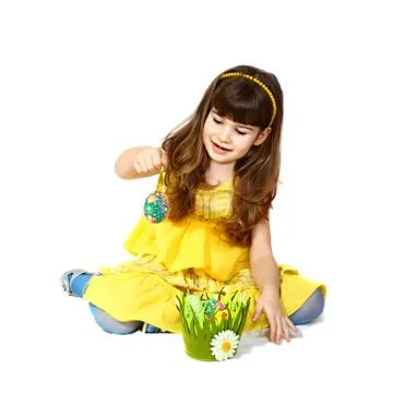 Girl plays with easter egg Stock Photos