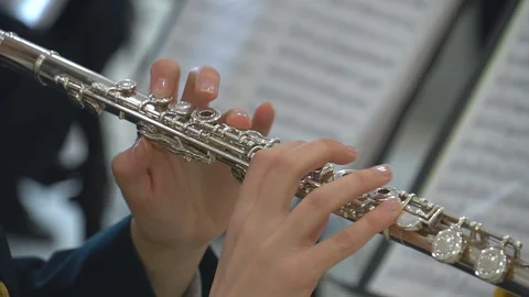 The girl plays the flute. Wind instruments Video stock 106857955