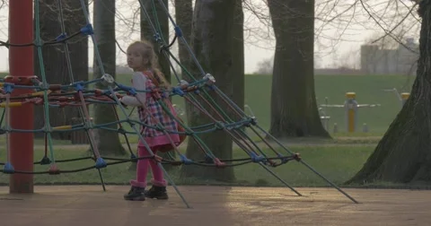The Girl Plays in a Shadow of the Tree Stock Footage 61897950