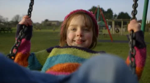 Girl plays on swing Stock Footage 22226880