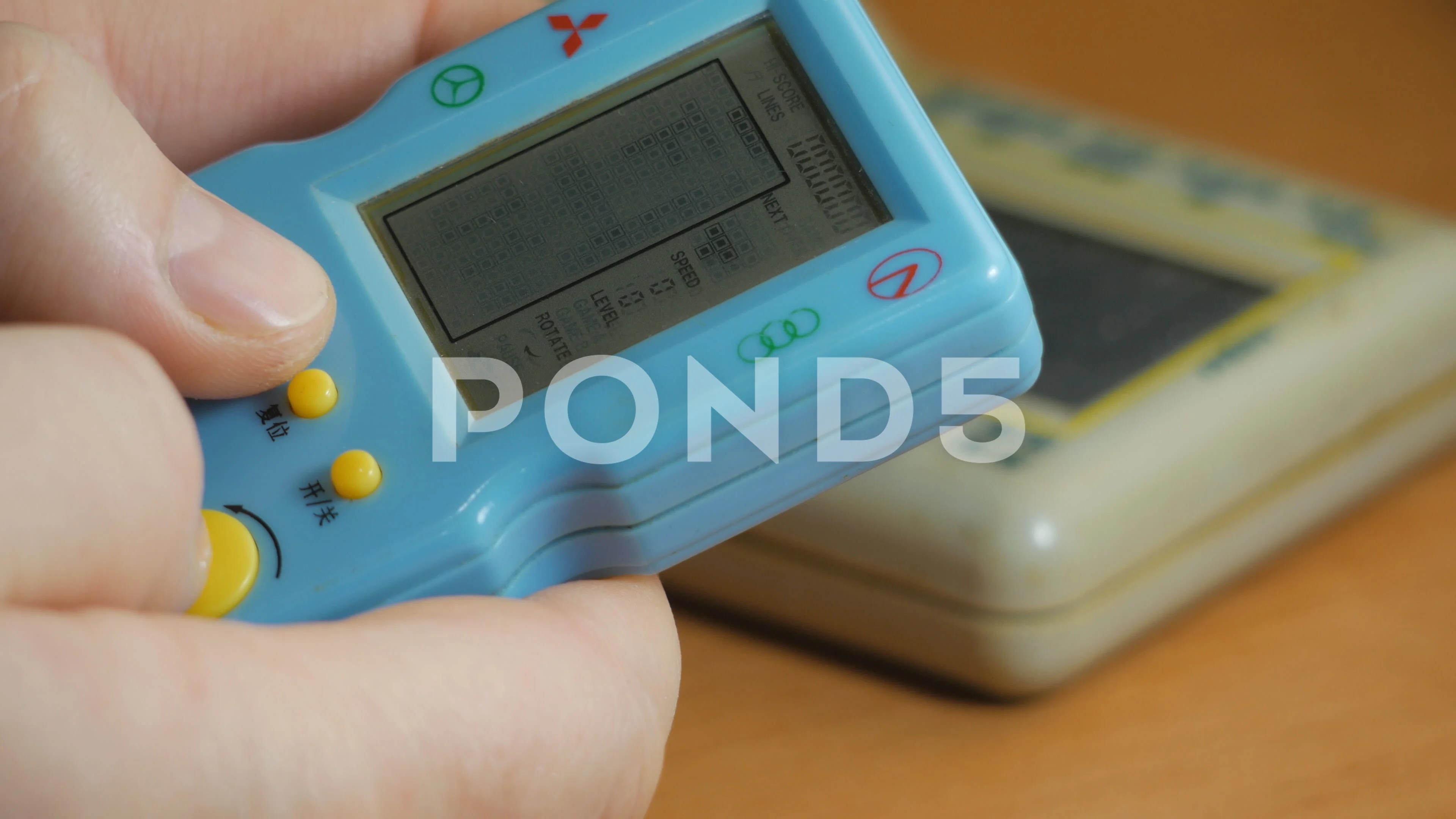 Girl plays Tetris, 90s game console | Stock Video | Pond5