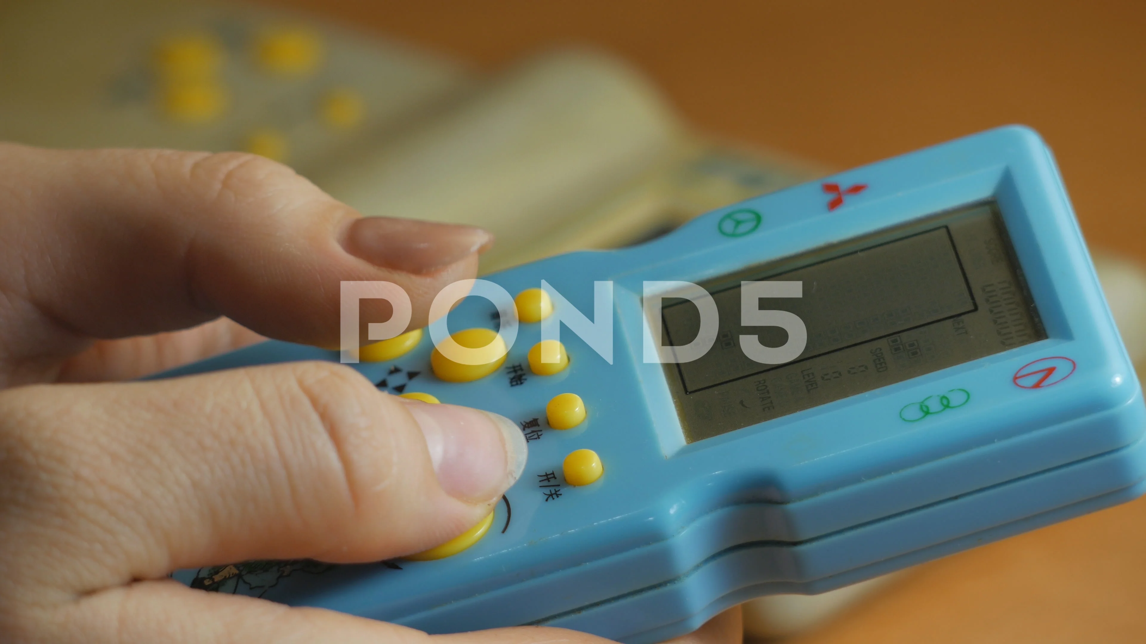 Girl plays Tetris, 90s game console | Stock Video | Pond5