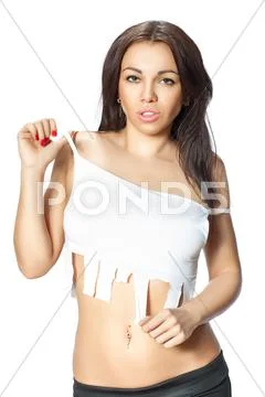 Girl points to his shirt where you can write Stock Photos