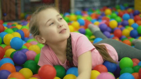Girl in the pool of balls Stock-Footage 106199562
