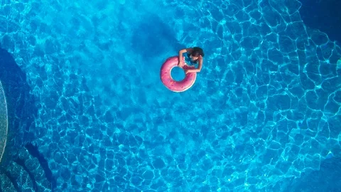 Girl in the pool. drone view Stock-Footage 97695352