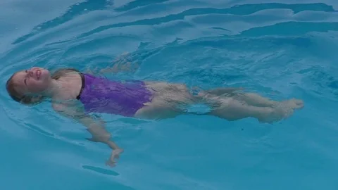 Girl in the pool Stock Footage 84726334