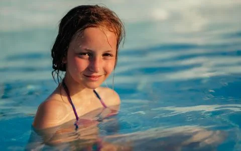 Girl in pool Stock Photos