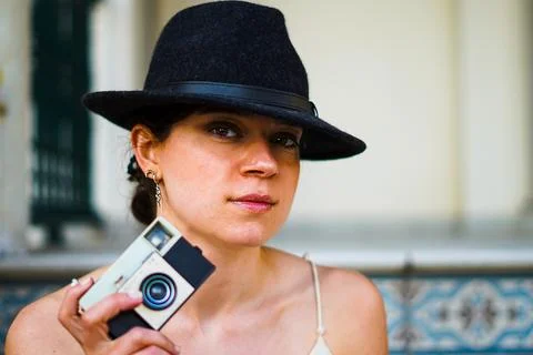 Girl posing with an analog camera Stock Photos