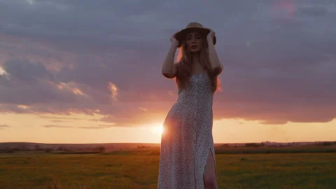 Girl posing for camera in a field Stock Footage 250483718