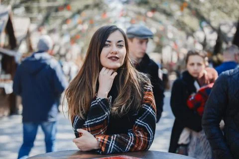Girl posing on camera resting at fair Stock Photos