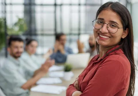 Girl posing for the camera while sitting against the background of her Stock Photos