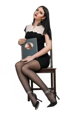 Girl posing on a chair Foto stock