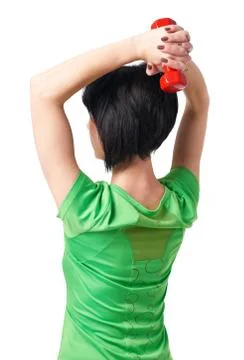 Girl posing with dumbbells in studio, isolate on white background, sport and  Foto stock