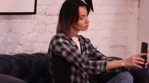 Girl posing in front of a camera makes selfie Stockbeeldmateriaal 68910389