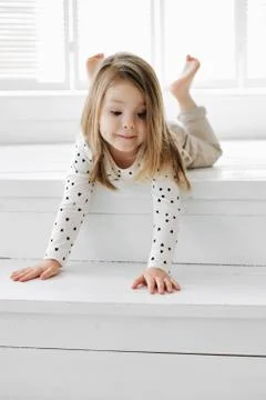 A girl posing in front of a window 스톡 사진