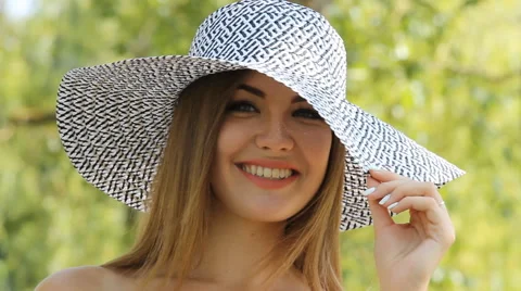 Girl posing in a hat outdoors Stock Footage 66772052
