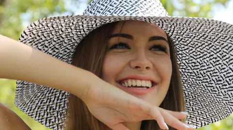 Girl posing in a hat outdoors Stock Footage 66772906