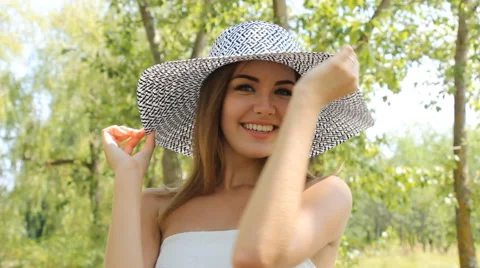 Girl posing in a hat outdoors Stock Footage 66773111