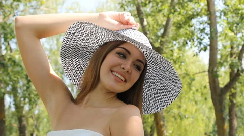 Girl posing in a hat outdoors Stock Footage 66774076