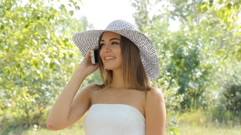 Girl posing in a hat outdoors Stock Footage 66774140