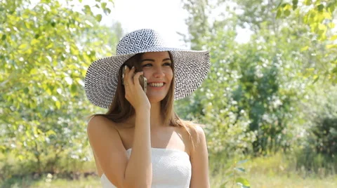 Girl posing in a hat outdoors Stock Footage 66774192