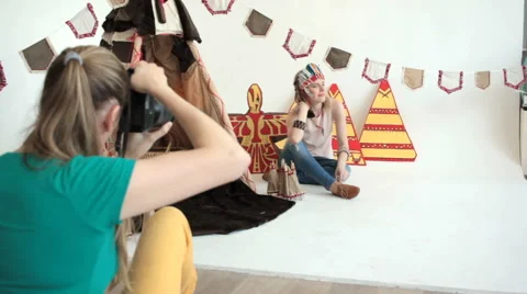 Girl posing in indian accessories at wigwam 스톡 동영상 65367853