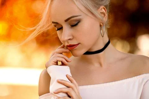 Girl posing in the light of setting sun. Stock Photos