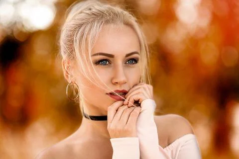 Girl posing in the light of setting sun. Stock Photos