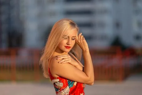 Girl posing in the light of setting sun. Stock Photos