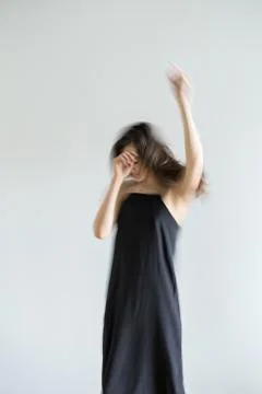 Girl posing in motion in studio Stock-Fotos