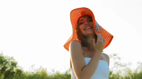 Girl posing on the shore in a hat Stock Footage 66724722