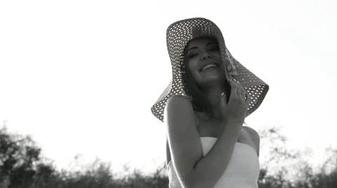 Girl posing on the shore in a hat Stock Footage 66724731