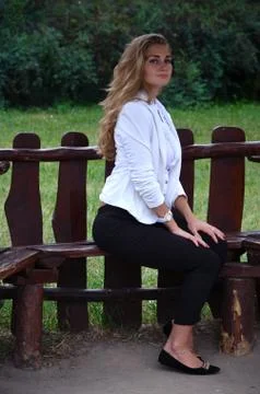 Girl posing sitting Stock Photos